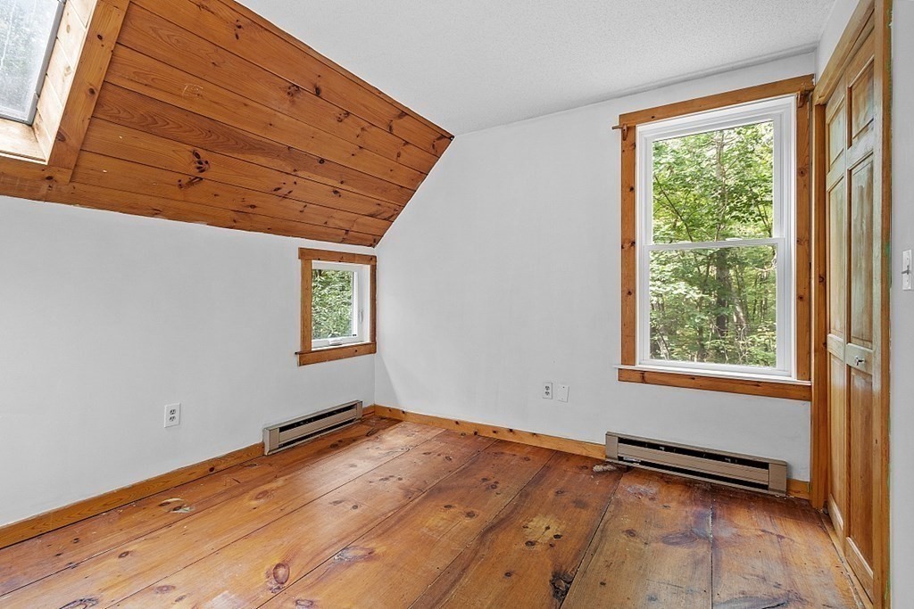 444 Old Dana Road Barre, MA 01005 - Photo 27 of 39 a view of a room with wooden floor and windows