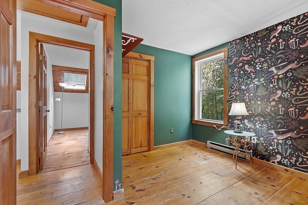 444 Old Dana Road Barre, MA 01005 - Photo 29 of 39 a view of a room that has a large window and wooden floor