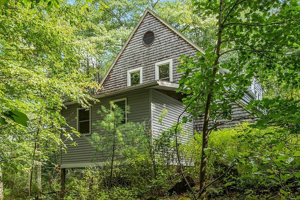 444 Old Dana Road Barre, MA 01005 - Photo 36 of 39 a backyard of a house with plants and garden