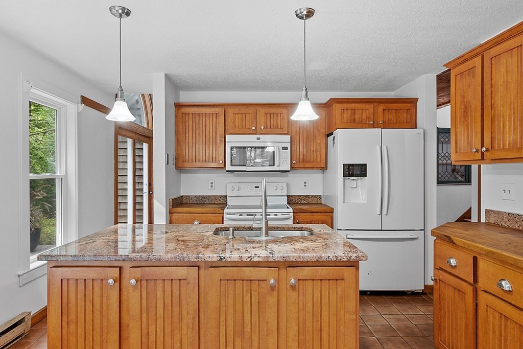 444 Old Dana Road Barre, MA 01005 - Photo 4 of 39 a kitchen with stainless steel appliances granite countertop a refrigerator a stove and a sink