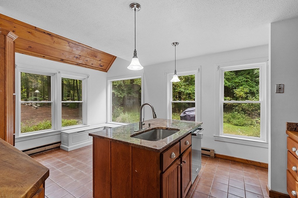 444 Old Dana Road Barre, MA 01005 - Photo 5 of 39 a kitchen with a sink stove and a kitchen island