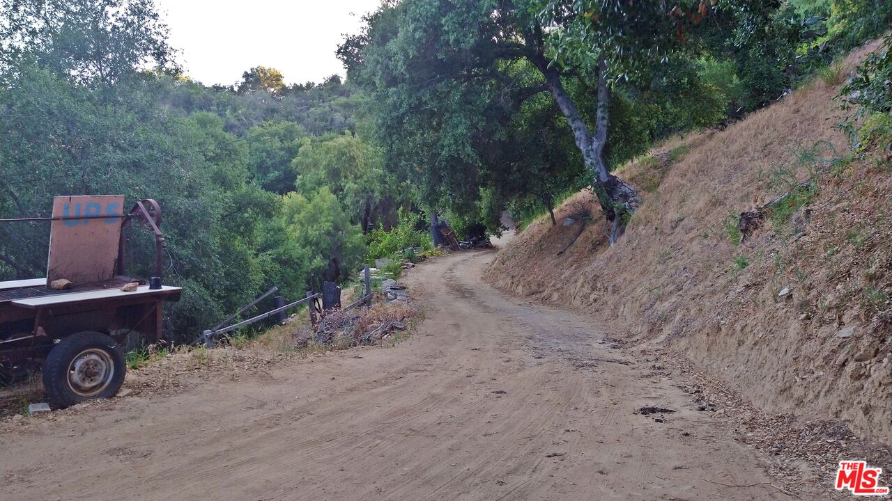 21190 Summit Road Topanga, CA 90290 - Photo 12 of 17 a view of a car in a dirt road