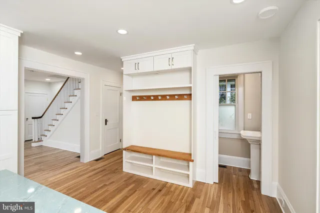 a view of an entryway with wooden floor