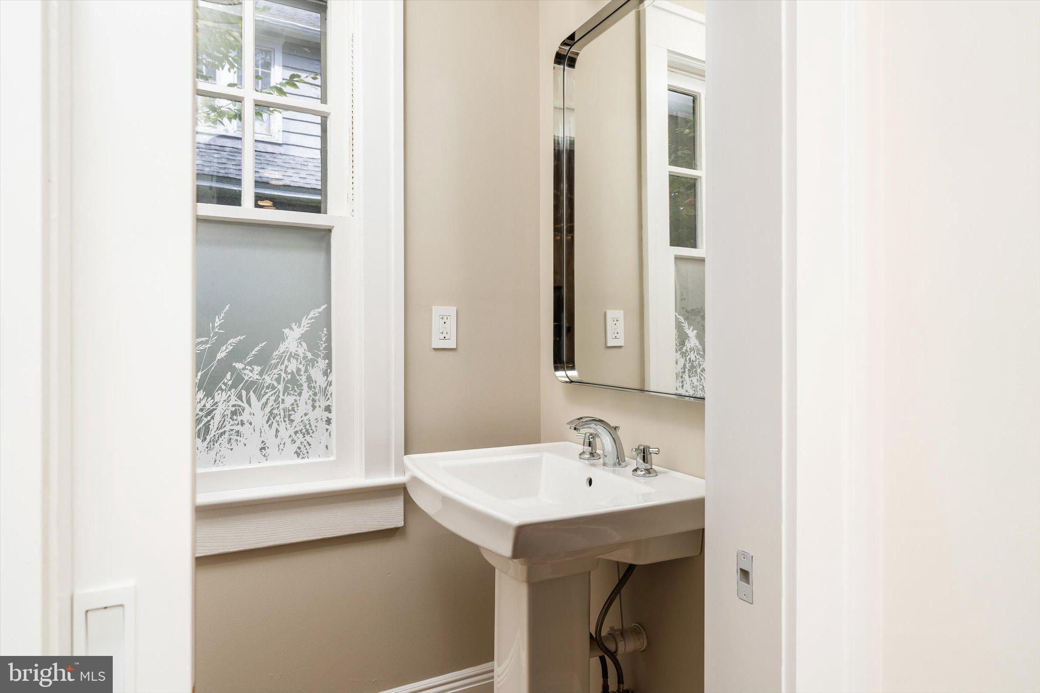 2148 Pennington Road Ewing, NJ 08638 - Photo 16 of 30 a bathroom with a sink and a mirror