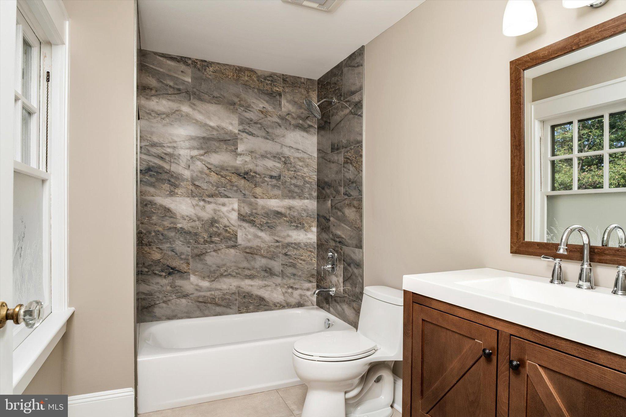 2148 Pennington Road Ewing, NJ 08638 - Photo 19 of 30 a bathroom with a sink a toilet and shower