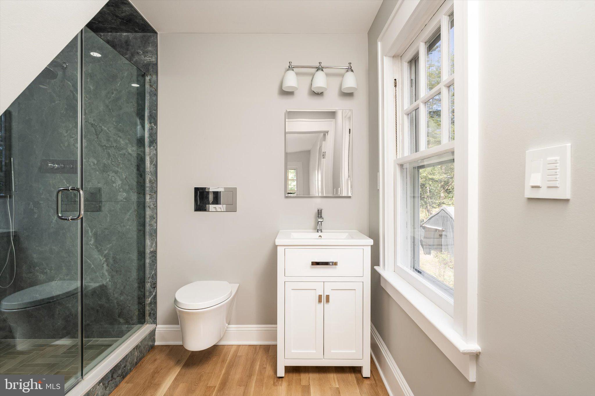 2148 Pennington Road Ewing, NJ 08638 - Photo 24 of 30 a bathroom with a toilet sink and a mirror