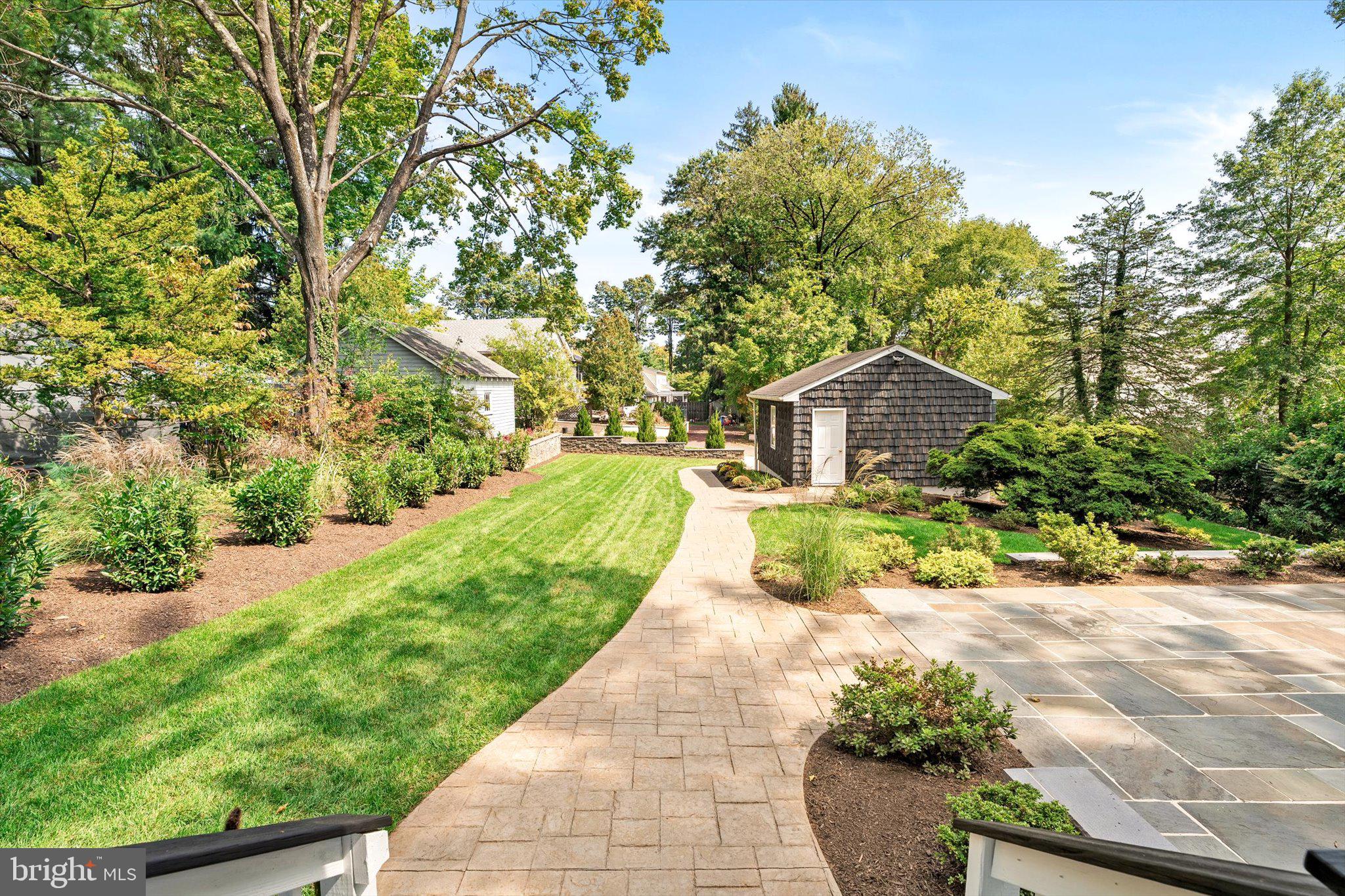 2148 Pennington Road Ewing, NJ 08638 - Photo 25 of 30 a front view of a house with a yard and potted plants