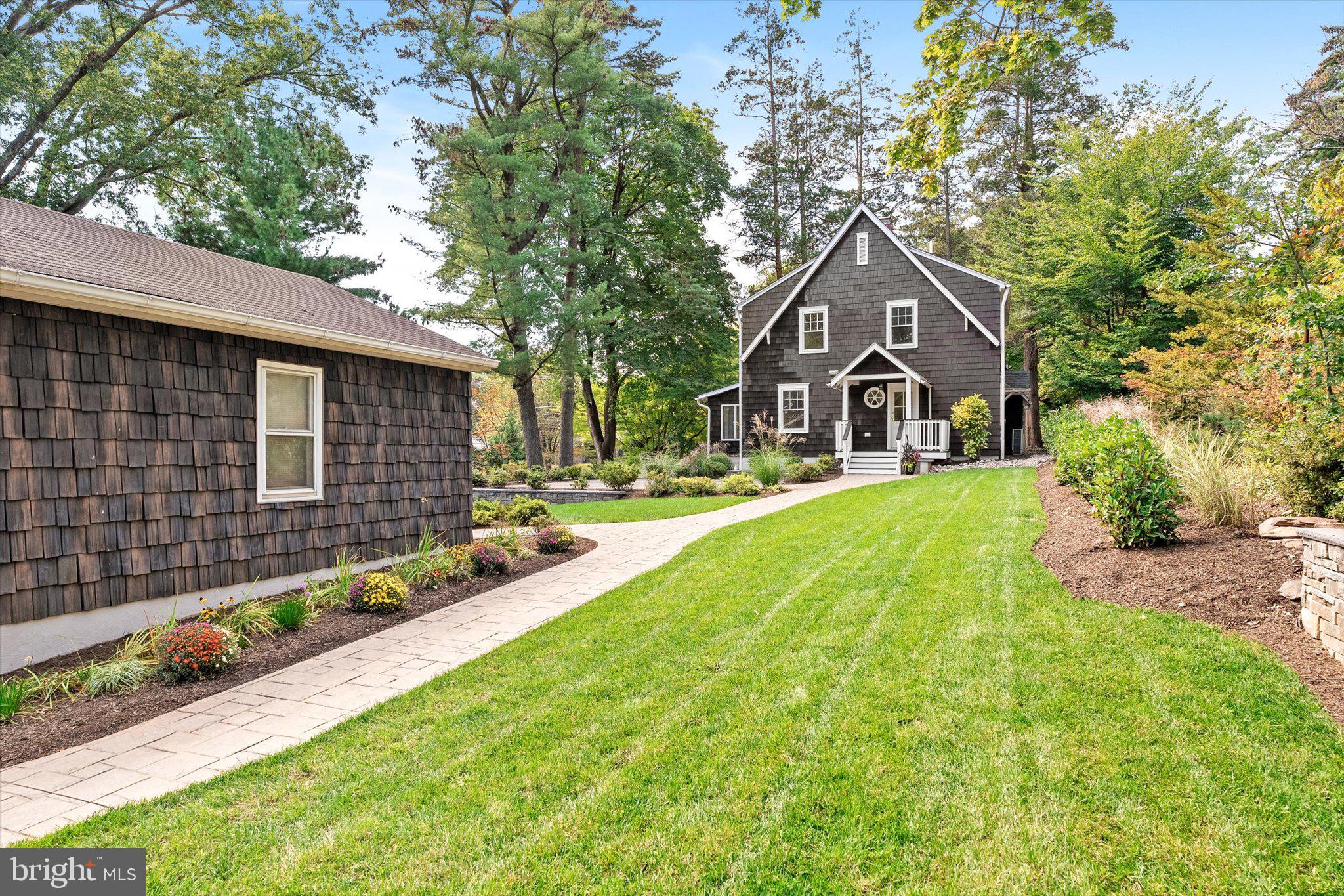 2148 Pennington Road Ewing, NJ 08638 - Photo 29 of 30 a front view of a house with a yard and garage