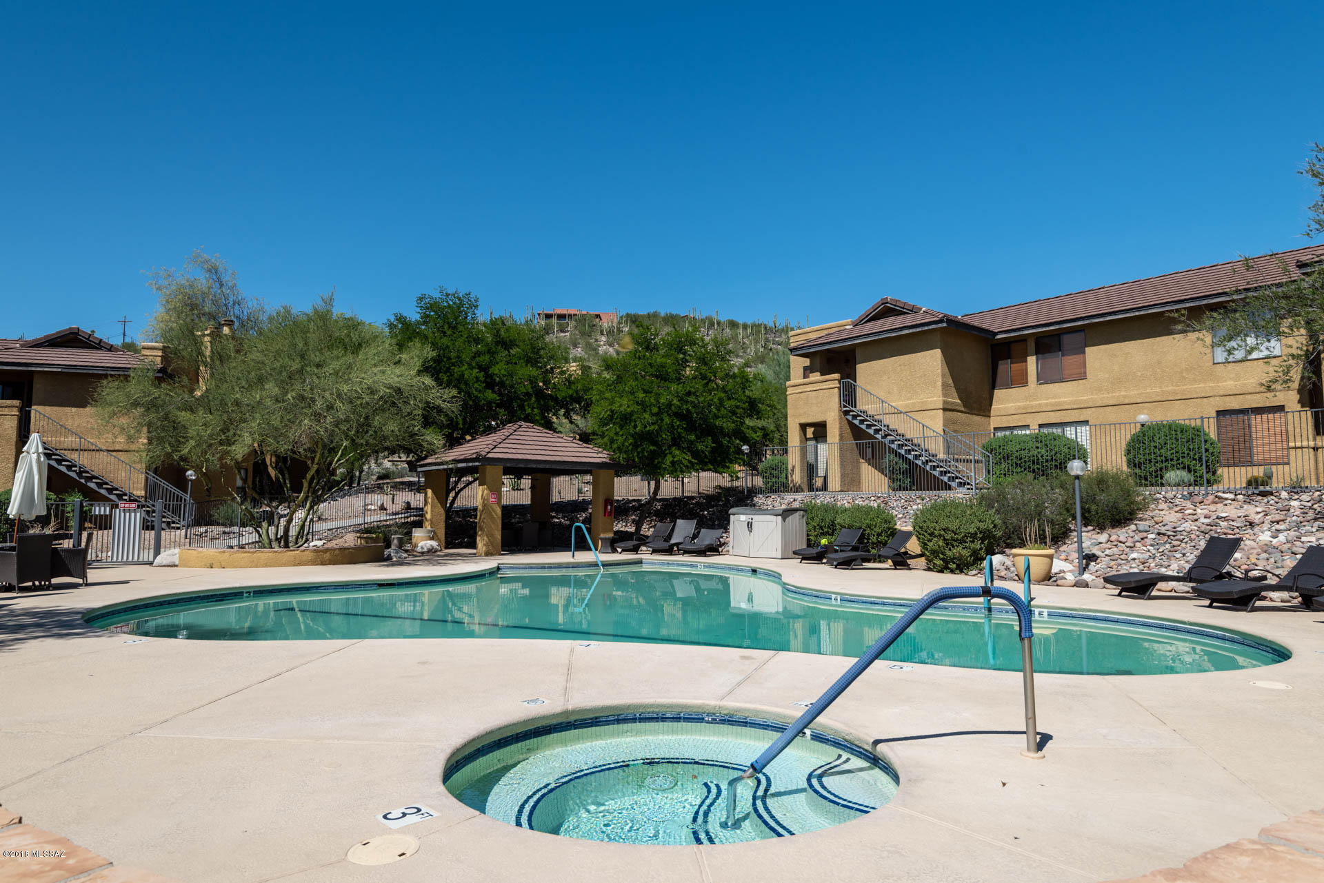7255 East Snyder Road, Unit 8205 Tucson, AZ 85750 - Photo 20 of 23 a table and chairs in the patio