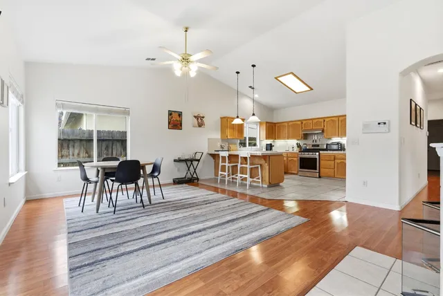 a view of a dining room with furniture and wooden floor