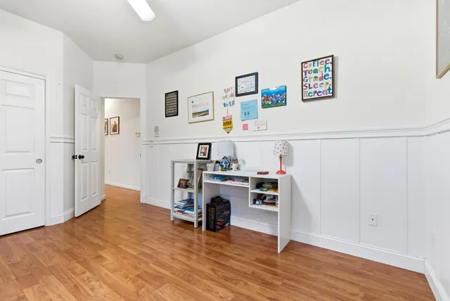a view of kitchen with furniture and wooden floor