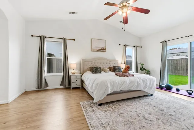 a bedroom with a bed and window