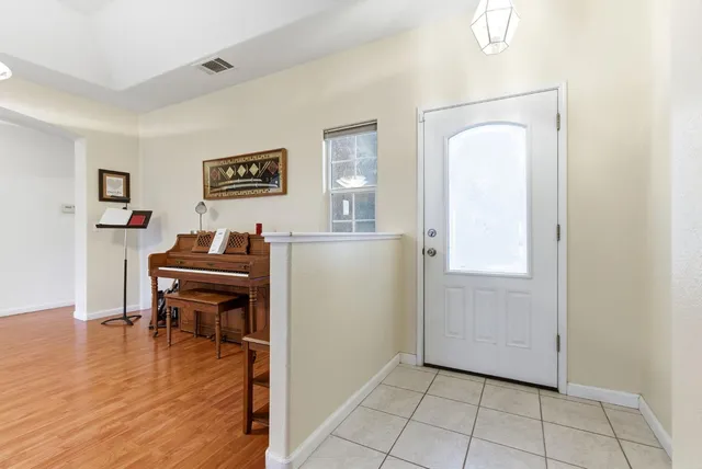 a view of a livingroom with furniture and wooden floor