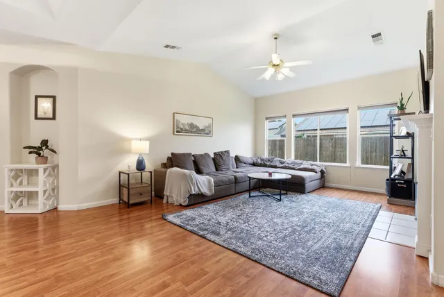 a living room with furniture and a large window