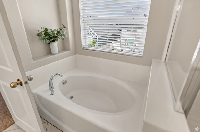 2178 Autumn Drive Mapleton, UT 84664 - Photo 20 of 48 Built-in soaking tub with chrome fixtures, integrated window, and recessed wall niche