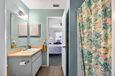 a en suite bathroom with a sink double vanity and a mirror