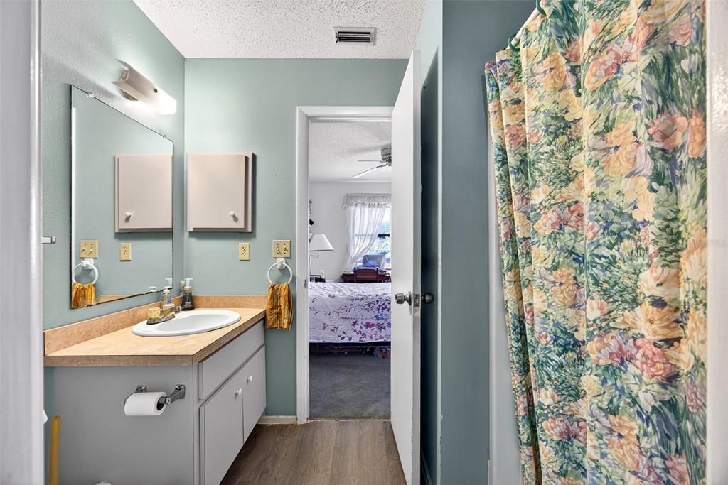 464 Coronado Road Venice, FL 34293 - Photo 13 of 28 a en suite bathroom with a sink double vanity and a mirror