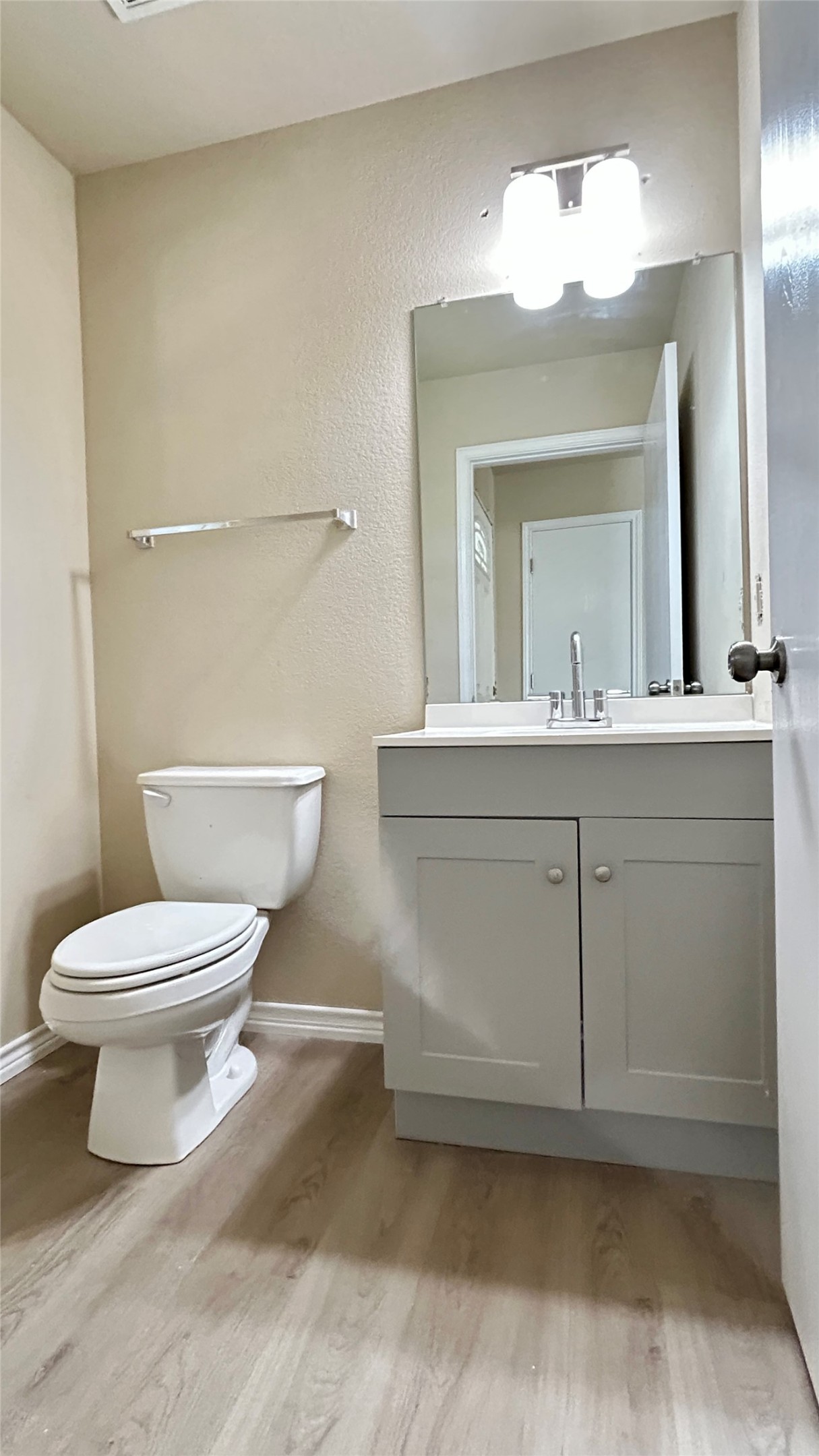 5211 Viewpoint Drive Austin, TX 78744 - Photo 19 of 25 a bathroom with a toilet a sink and mirror