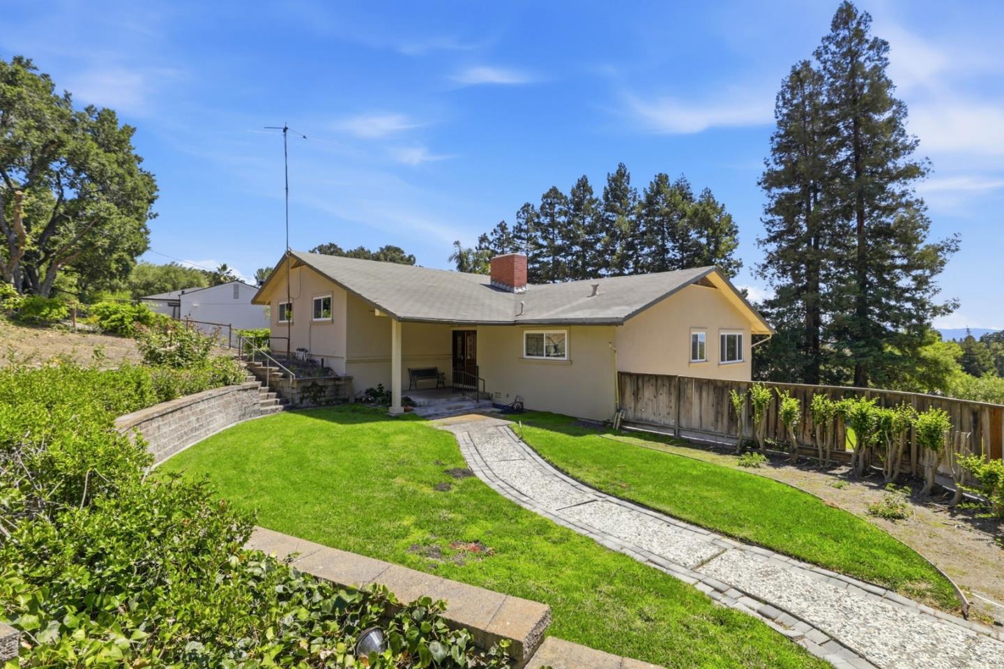 208 Mill Creek Road Fremont, CA 94539 - Photo 3 of 59 a front view of a house with a yard and garage