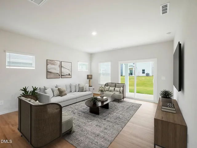 a black and white photo of a living room
