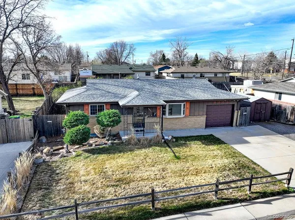 a view of a house with a yard patio and sitting area