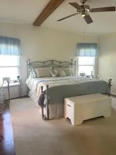 a room with a bed and cabinets