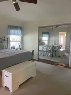 a bathroom with double vanity and a mirror