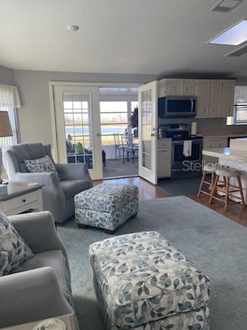 42 Seminole Path Wildwood, FL 34785 - Photo 33 of 59 a living room with furniture and a large window