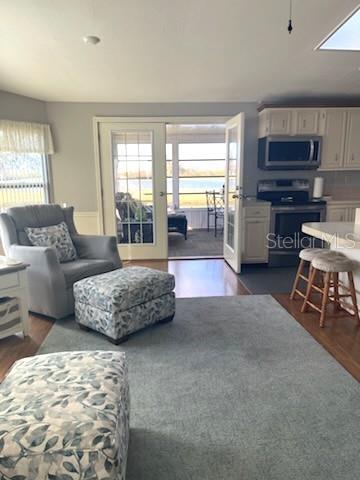 42 Seminole Path Wildwood, FL 34785 - Photo 37 of 59 a living room with furniture and a flat screen tv