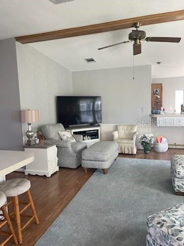 42 Seminole Path Wildwood, FL 34785 - Photo 39 of 59 a living room with furniture and a flat screen tv