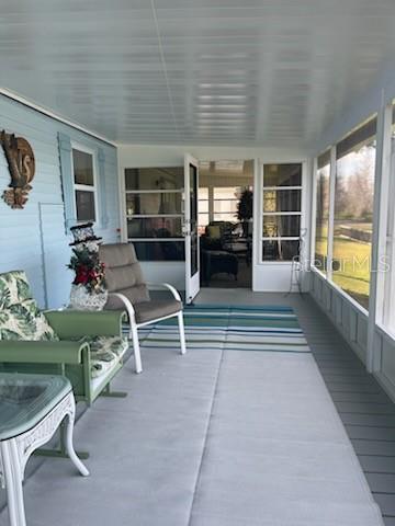 42 Seminole Path Wildwood, FL 34785 - Photo 51 of 59 a living room with furniture large window and flat screen tv