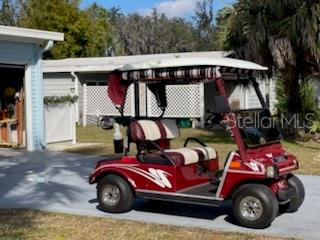 42 Seminole Path Wildwood, FL 34785 - Photo 58 of 59 a car parked in front of a house