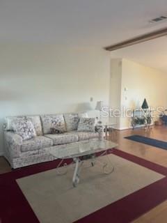 42 Seminole Path Wildwood, FL 34785 - Photo 6 of 59 a living room with a couch