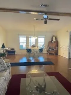 a view of a living room and dining room