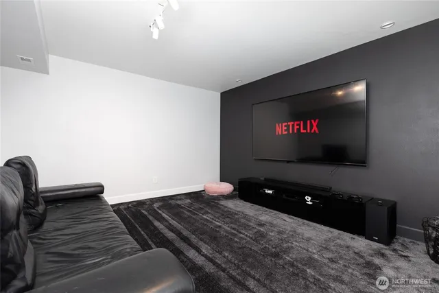 a bedroom with furniture and flat screen tv