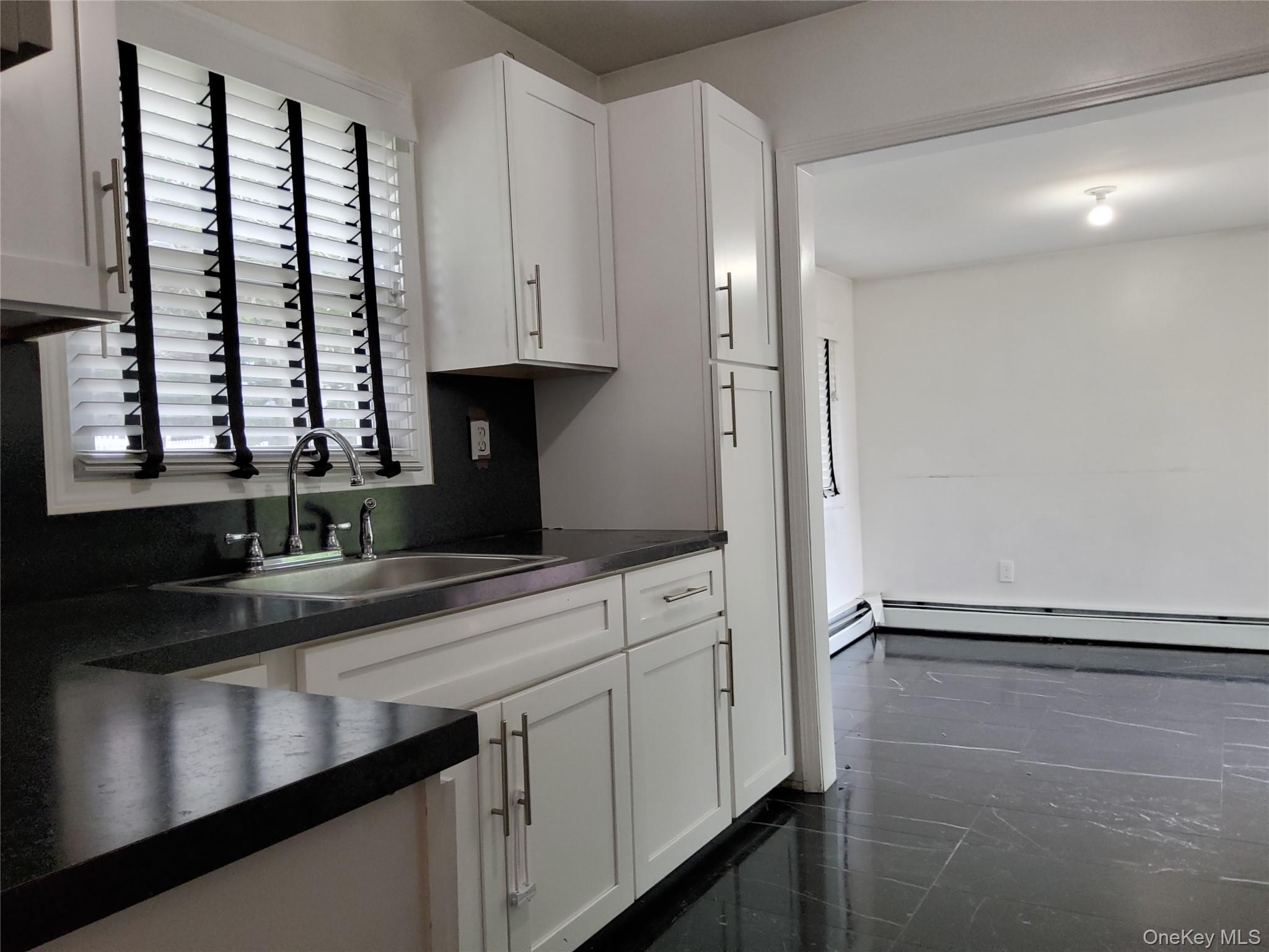 469 Hillside Road Monroe, NY 10950 - Photo 2 of 20 a kitchen with a sink and cabinets