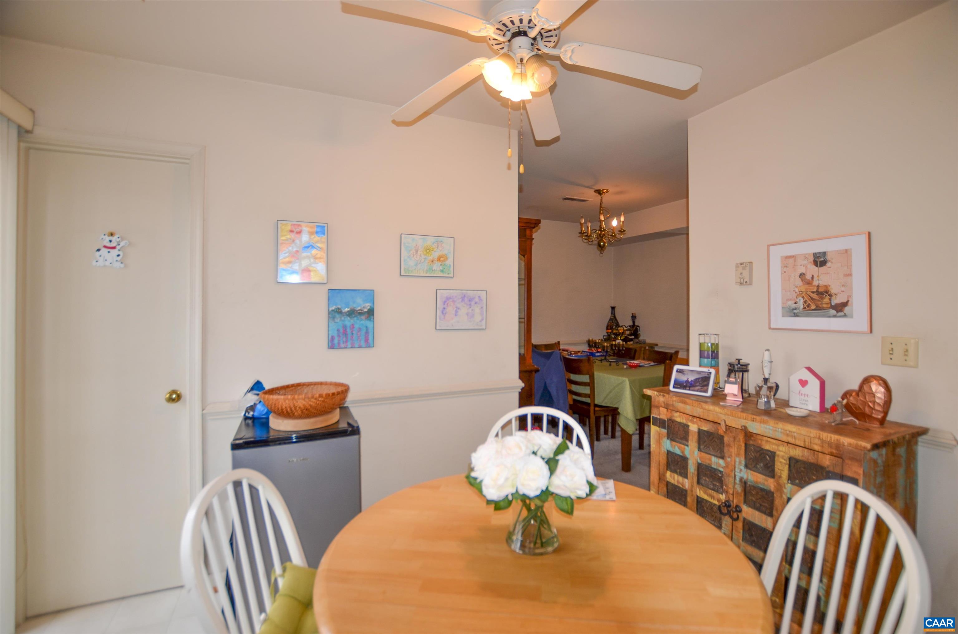 1594 Cool Spring Road Charlottesville, VA 22901 - Photo 6 of 26 a view of a dining room with furniture a chandelier and wooden floor