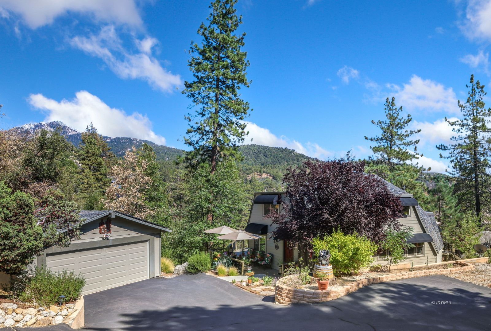 a view of a house with a tree in the background