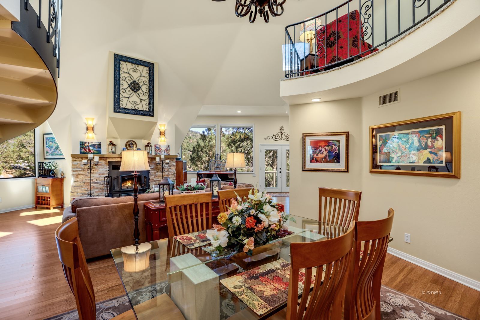 53599 West Ridge Road Idyllwild, CA 92549 - Photo 14 of 49 a view of a dining room and livingroom with furniture a rug a painting and a chandelier