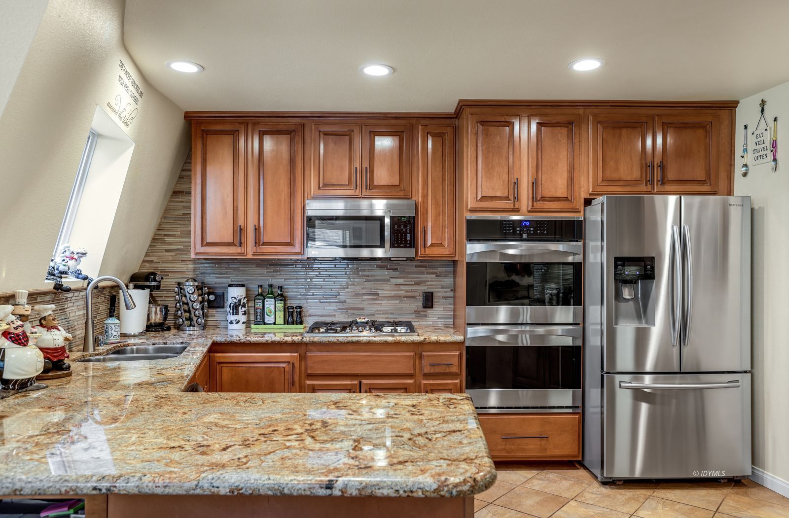 53599 West Ridge Road Idyllwild, CA 92549 - Photo 19 of 49 a kitchen with stainless steel appliances granite countertop a refrigerator sink and microwave