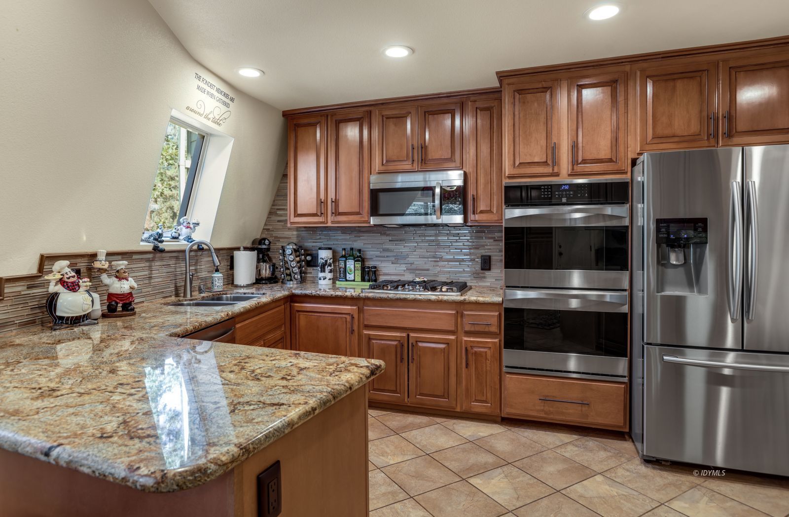 53599 West Ridge Road Idyllwild, CA 92549 - Photo 20 of 49 a kitchen with stainless steel appliances granite countertop a sink refrigerator and microwave