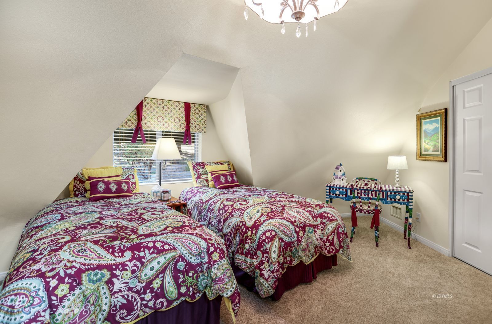 53599 West Ridge Road Idyllwild, CA 92549 - Photo 32 of 49 a bedroom with two beds and a chandelier