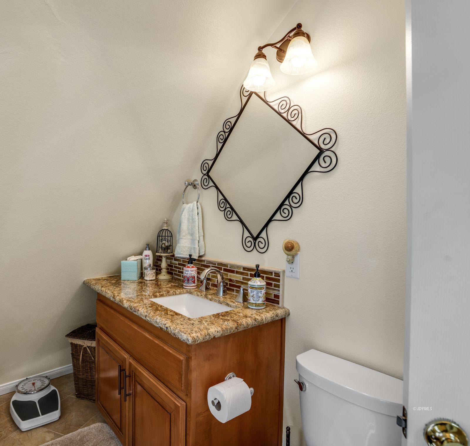 53599 West Ridge Road Idyllwild, CA 92549 - Photo 36 of 49 a bathroom with a granite countertop sink a toilet and mirror