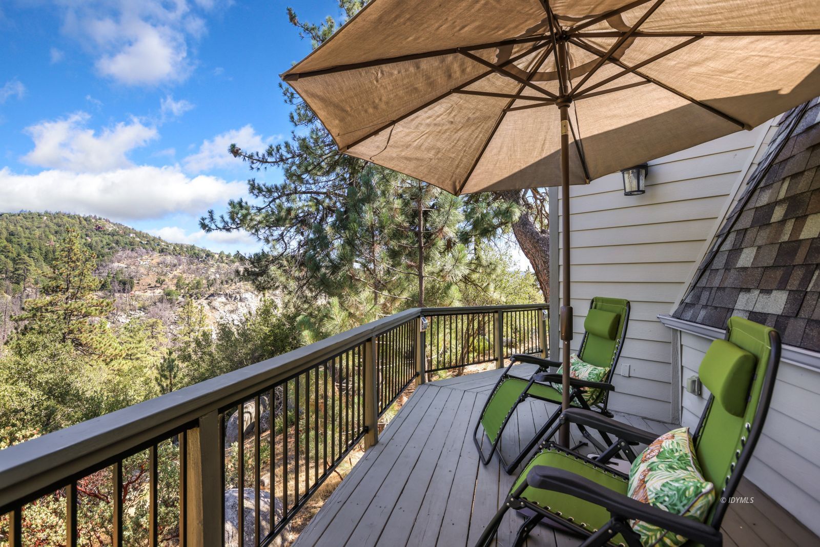 53599 West Ridge Road Idyllwild, CA 92549 - Photo 43 of 49 a view of a balcony with chairs and wooden fence