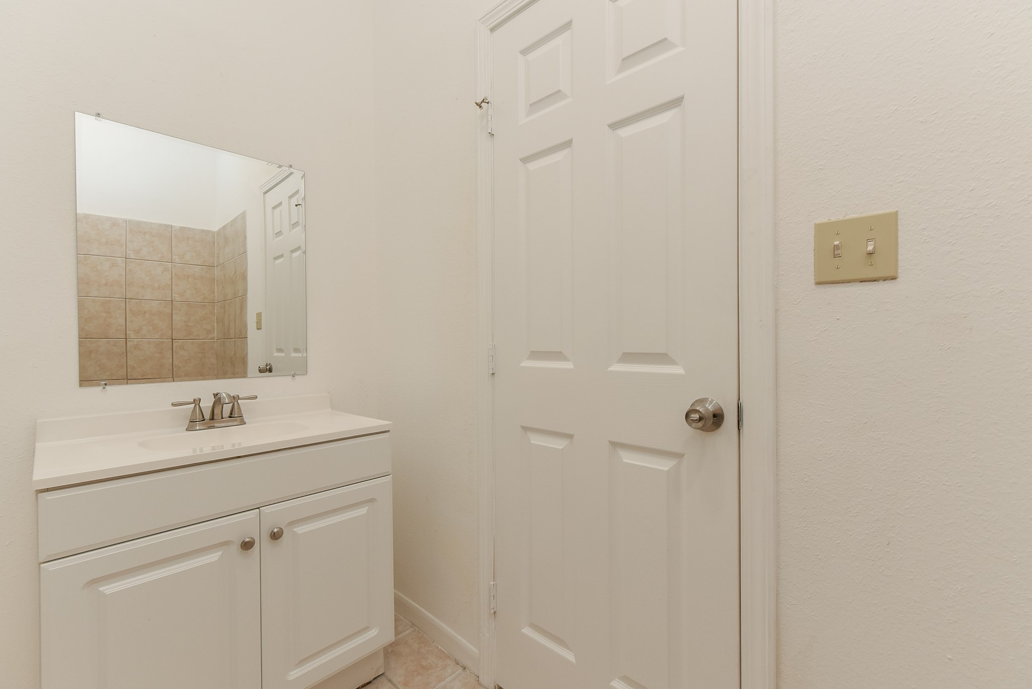 18610 Anne Drive Webster, TX 77058 - Photo 24 of 50 a bathroom with a sink and mirror