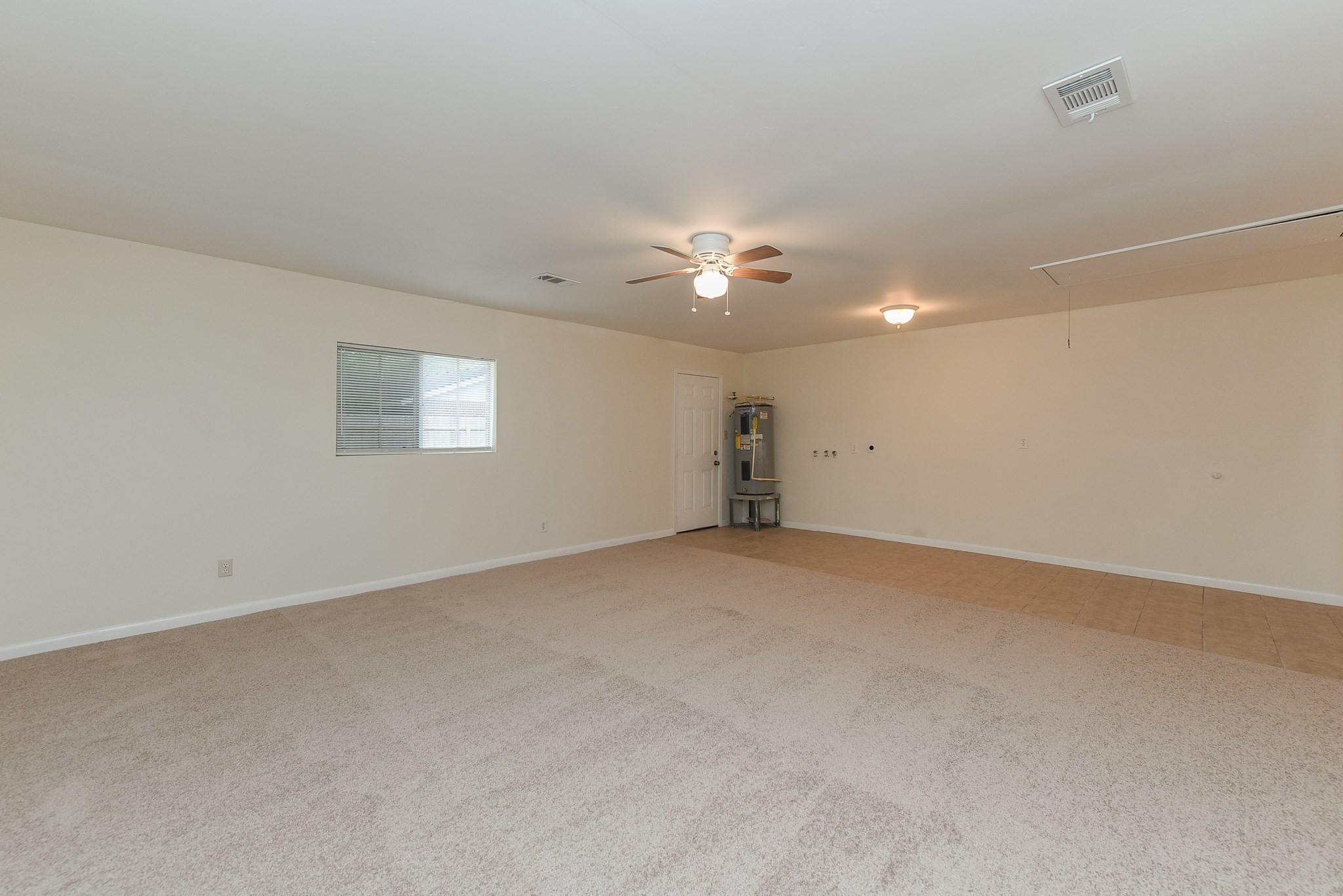 18610 Anne Drive Webster, TX 77058 - Photo 37 of 50 an empty room with a ceiling fan and a window