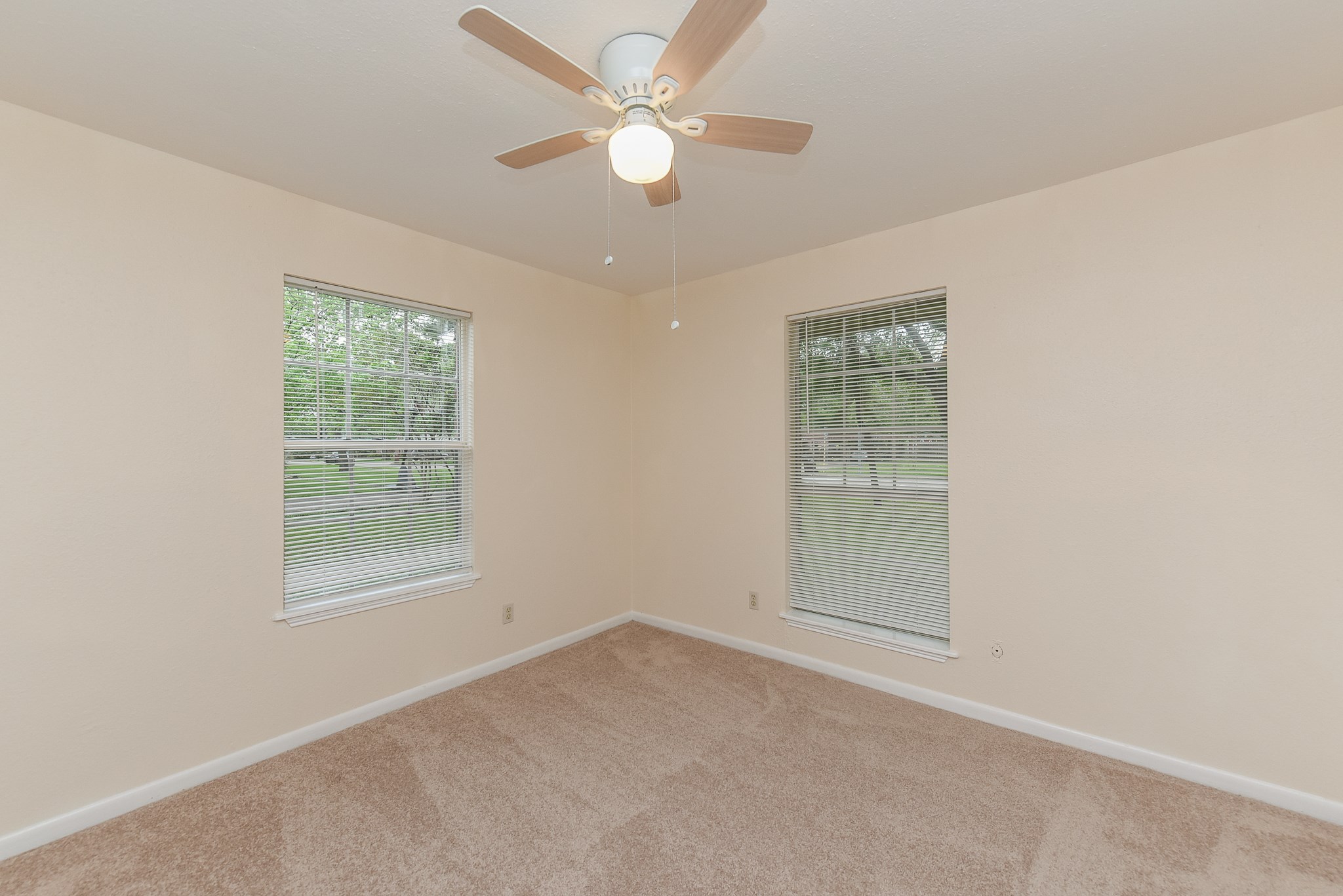 18610 Anne Drive Webster, TX 77058 - Photo 40 of 50 an empty room with a window and a fan