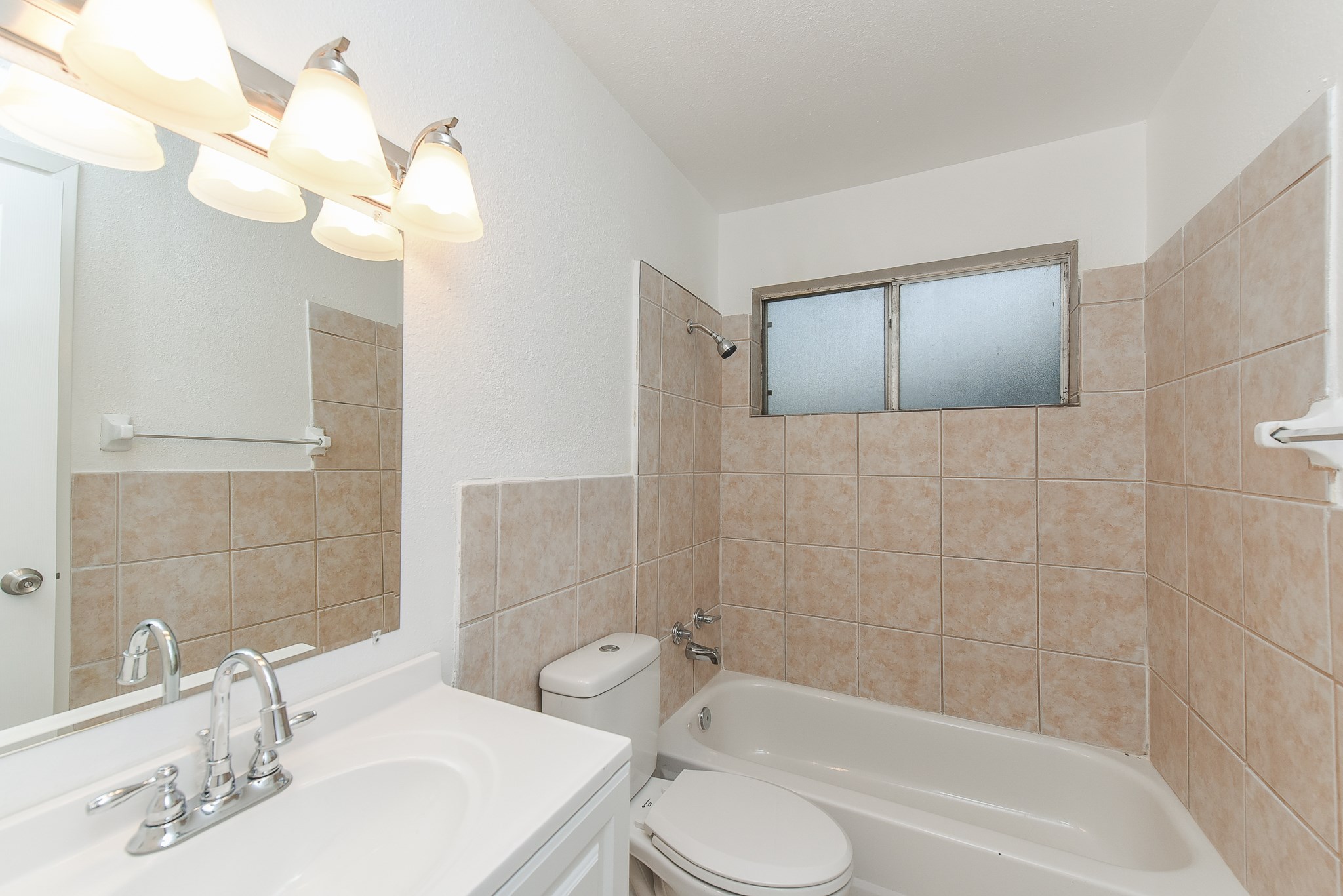 18610 Anne Drive Webster, TX 77058 - Photo 41 of 50 a bathroom with a sink a toilet and bathtub