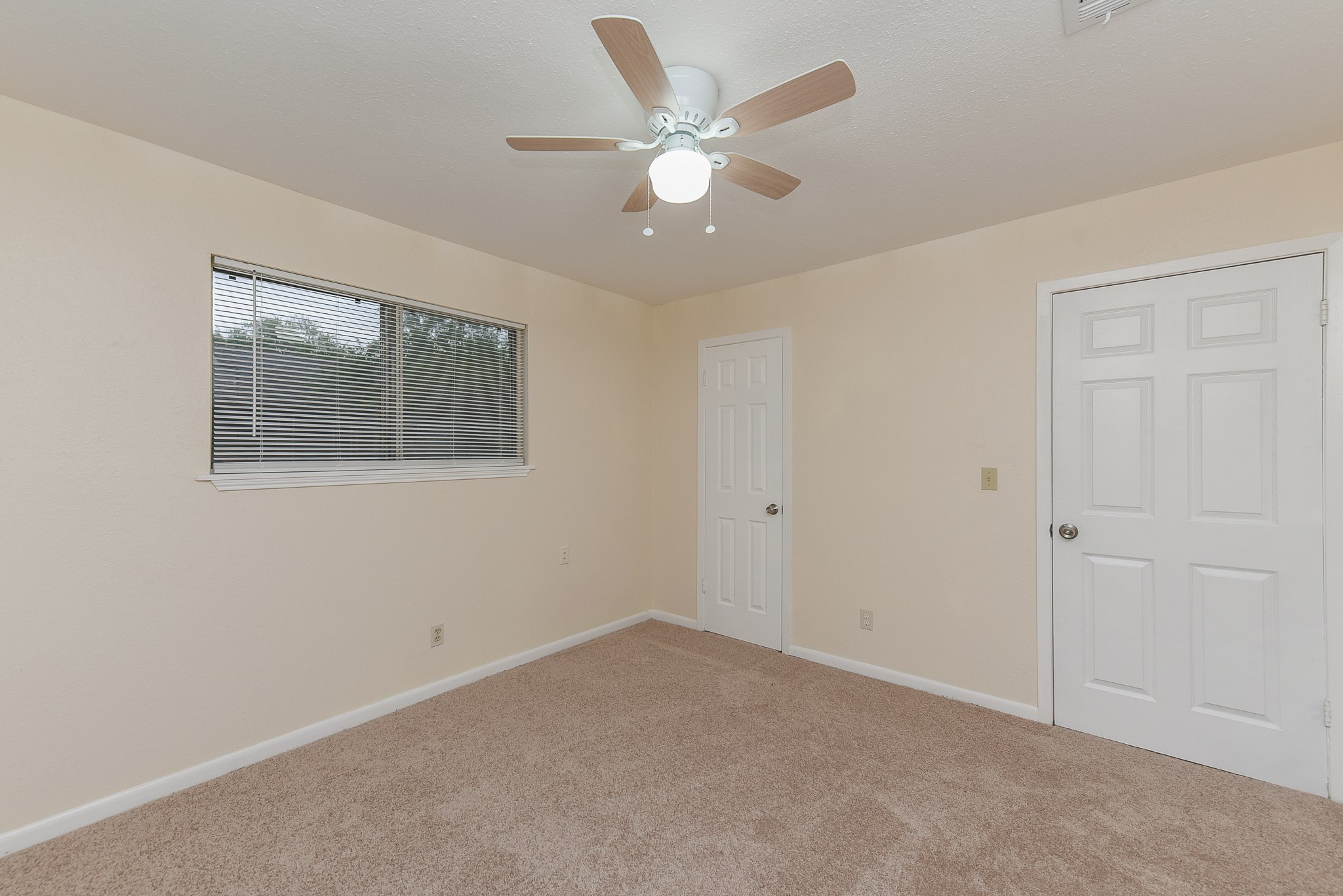 18610 Anne Drive Webster, TX 77058 - Photo 43 of 50 an empty room with a ceiling fan and a window