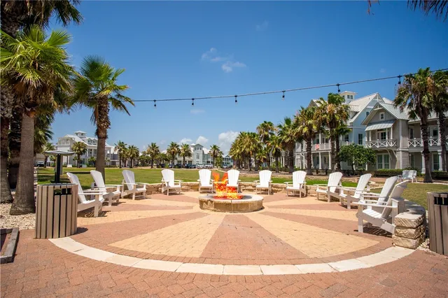 an aerial view of a houses with yard